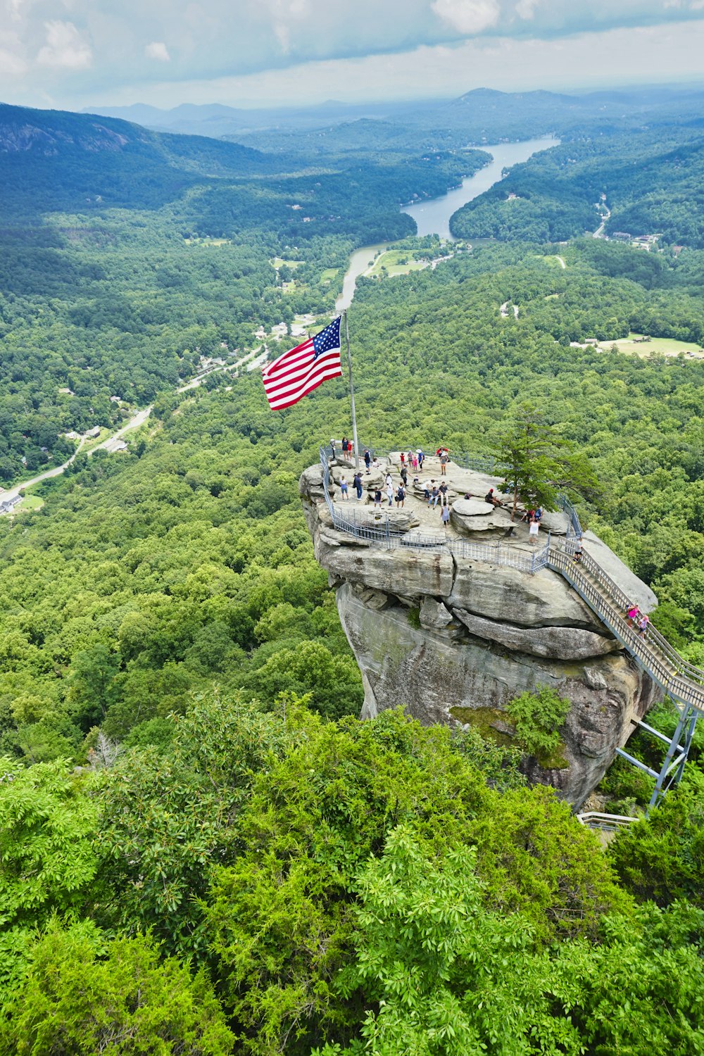 us a flag on top of rock formation