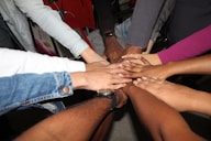 person wearing silver ring and white long sleeve shirt