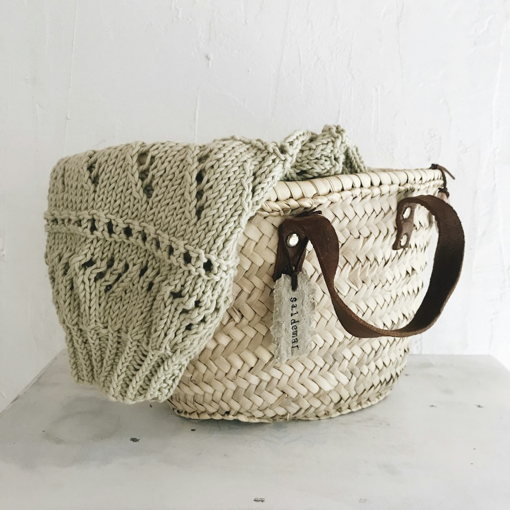 brown woven basket on white table