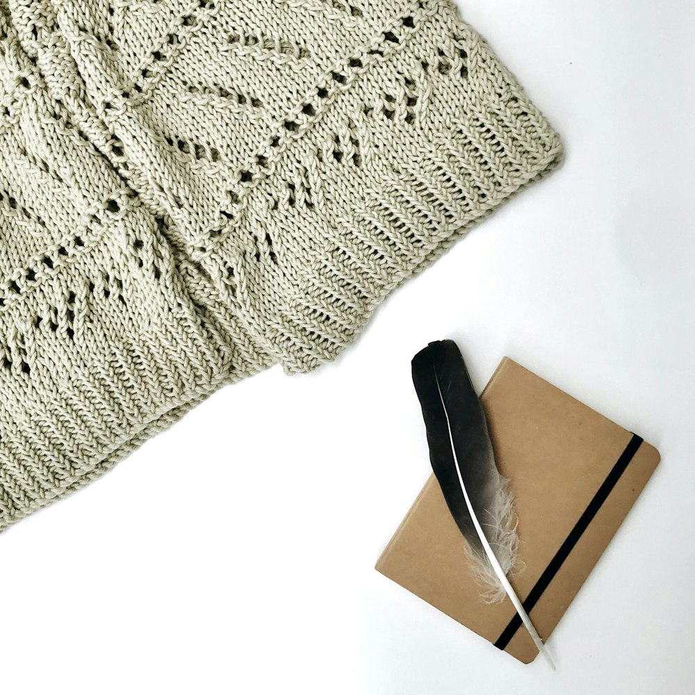 gray knit textile on white table