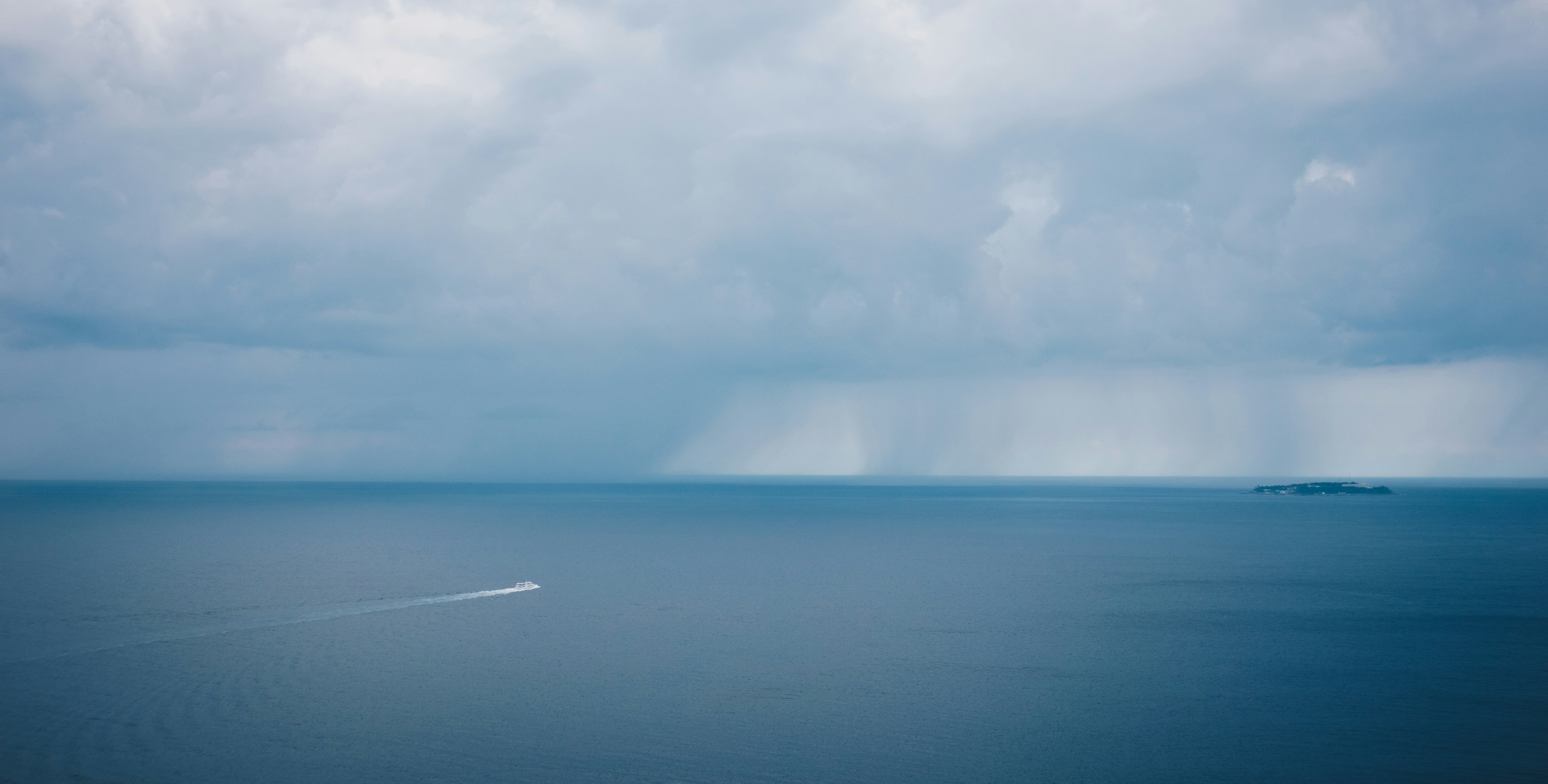 white clouds over blue sea