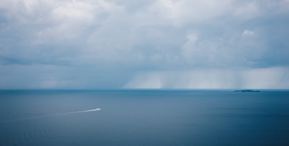 white clouds over blue sea