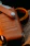 brown leather bag on gray textile