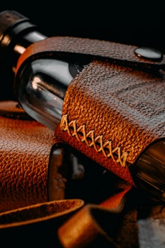 brown leather strap on brown leather textile
