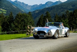 white porsche 911 on road during daytime