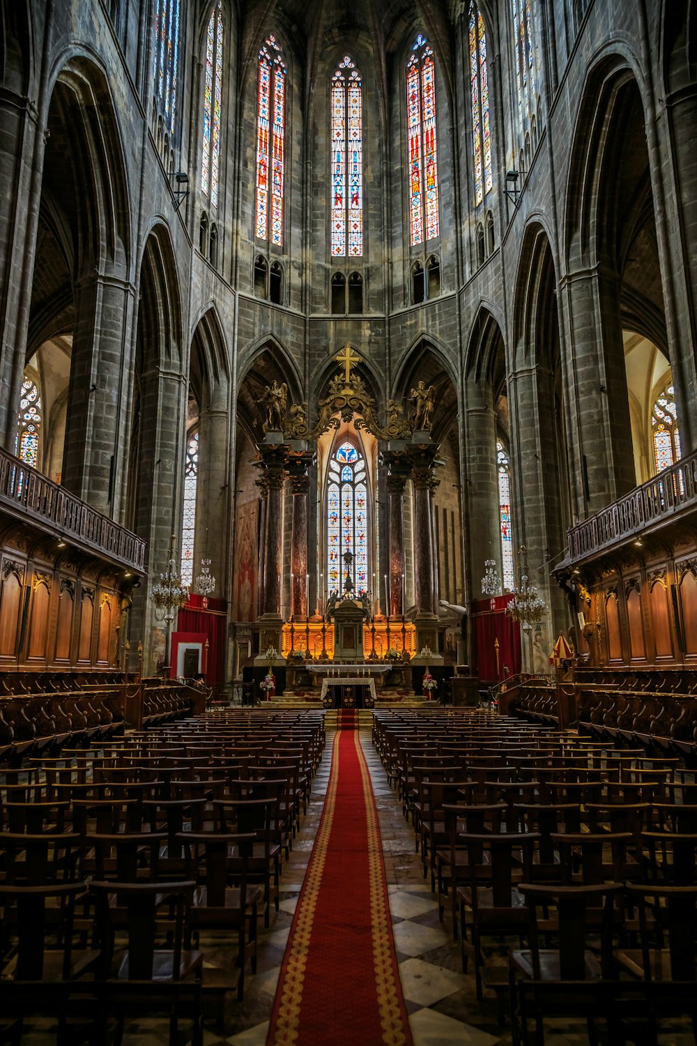 brown wooden bench inside cathedral