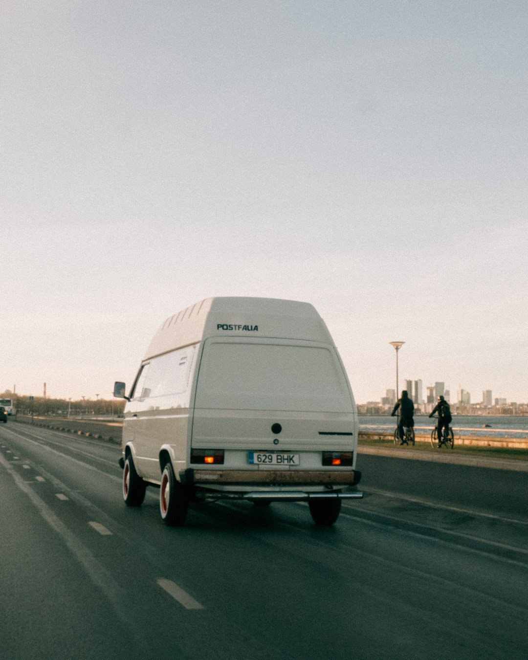 white van on road during daytime