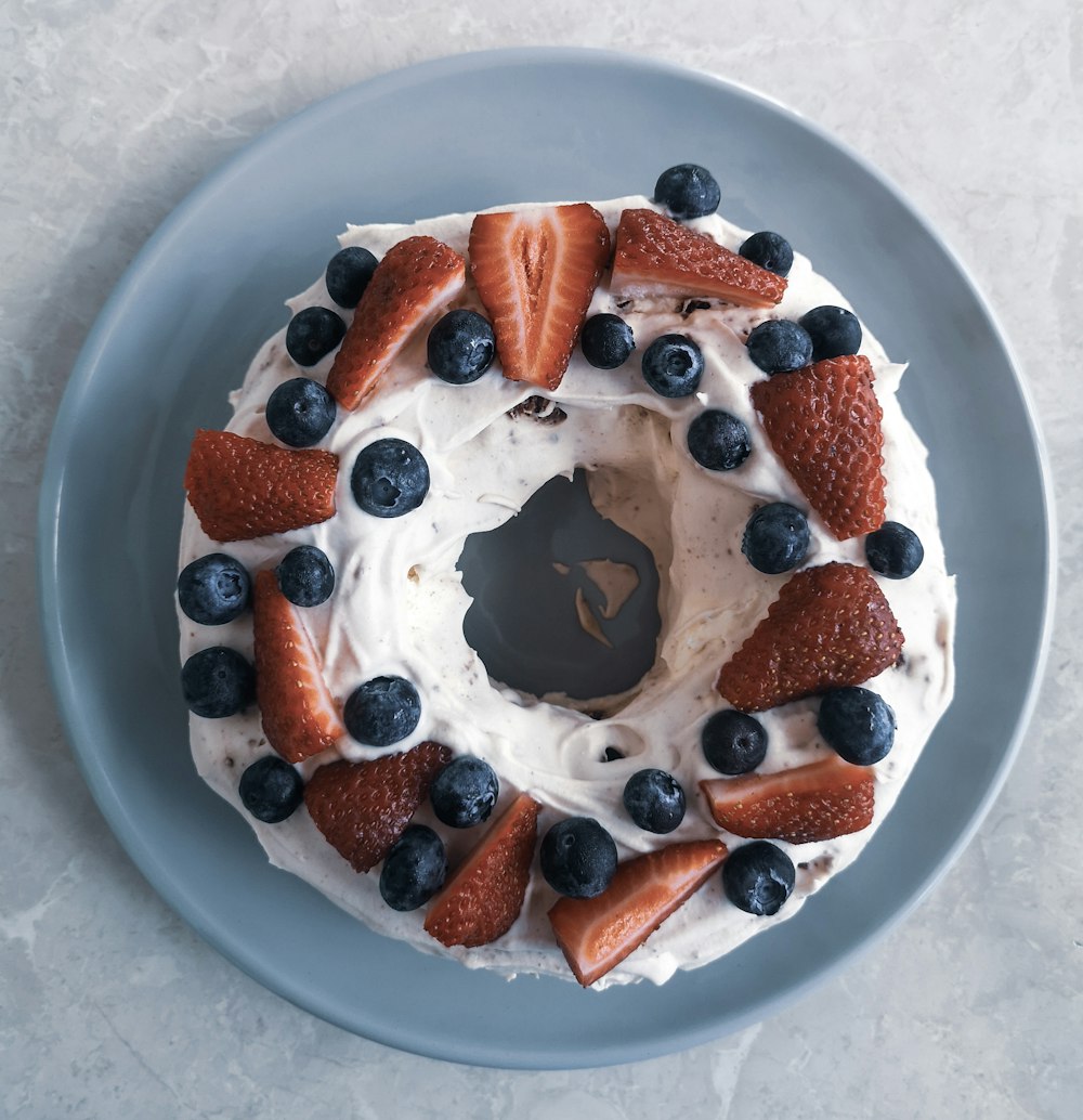 chocolate cake with white icing on white ceramic plate