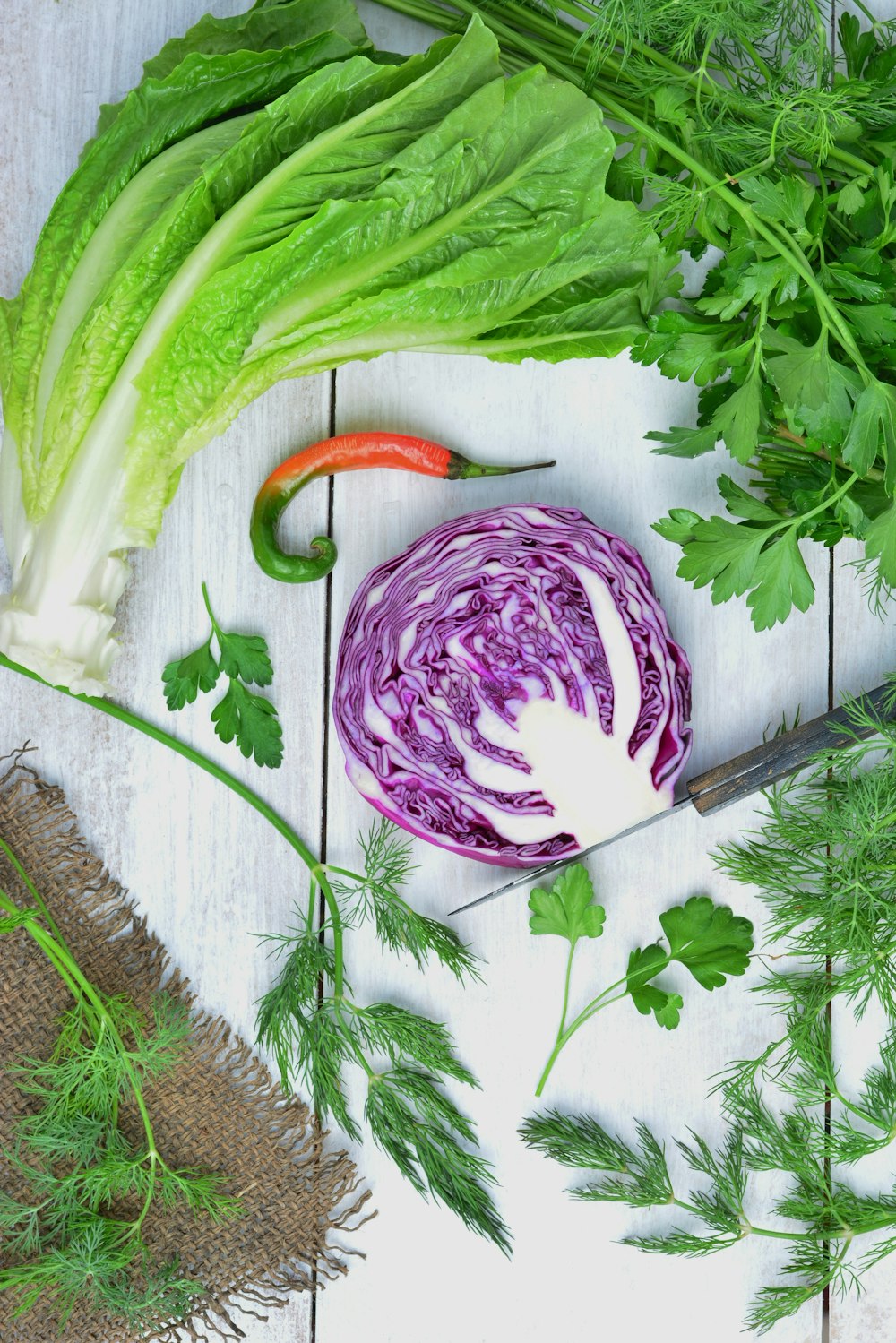 green and purple vegetable on white textile