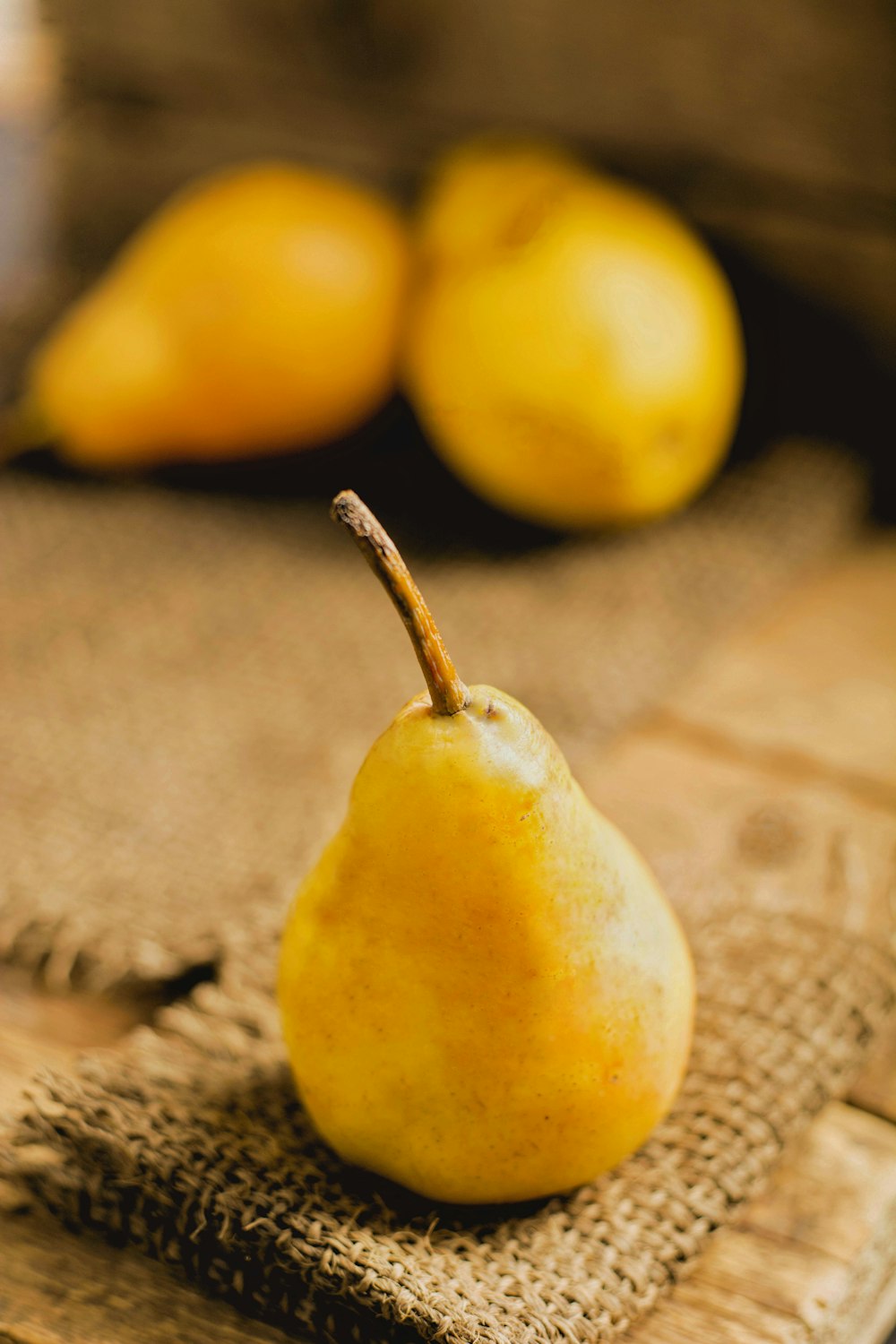 yellow lemon fruit on brown textile