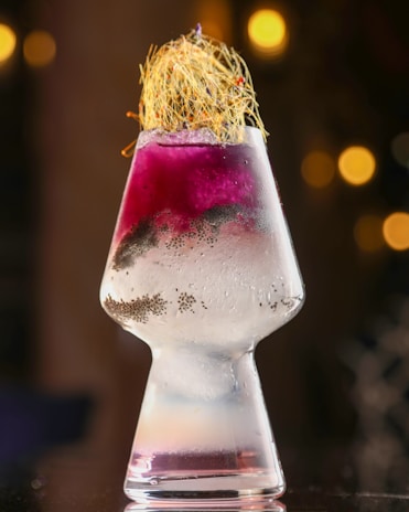 Close-up of a beautifully crafted drink with vibrant colors served by dekur.