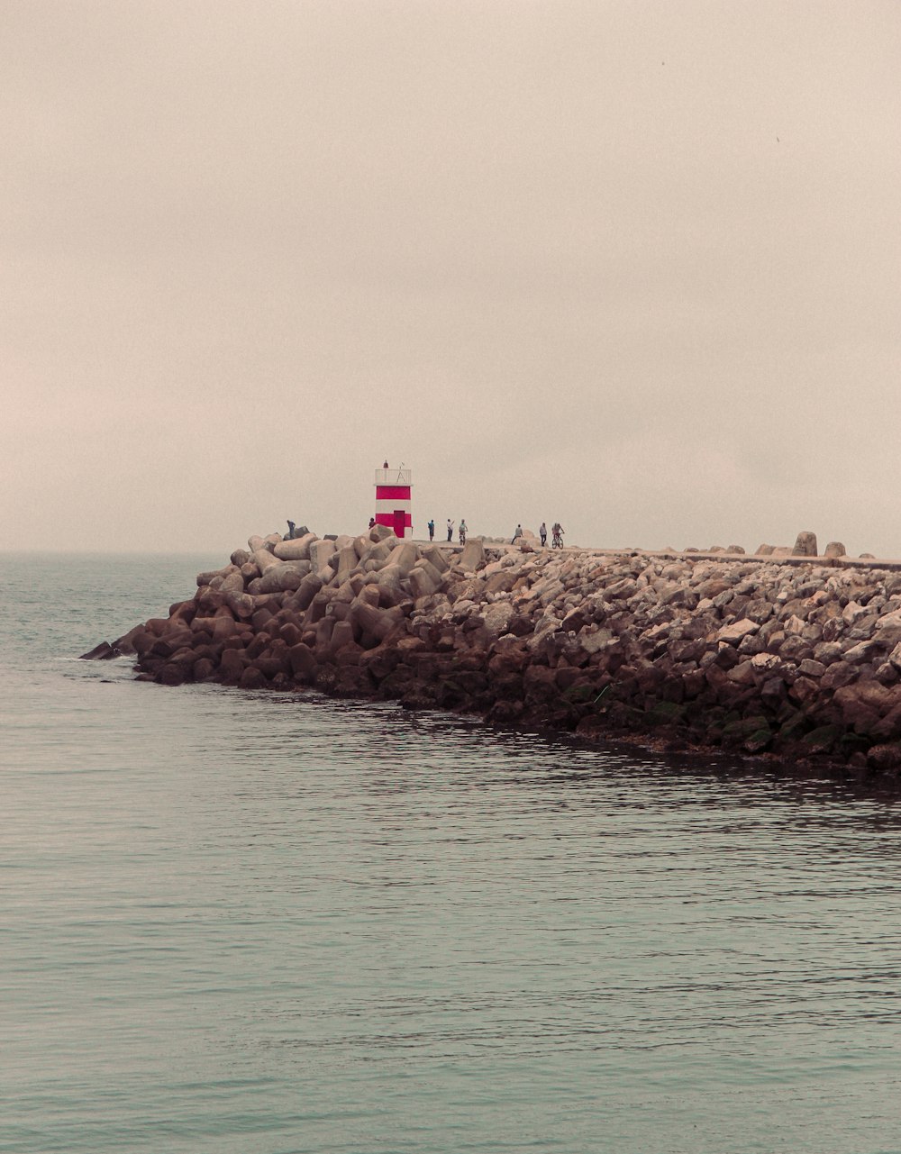 gray rock formation on sea during daytime