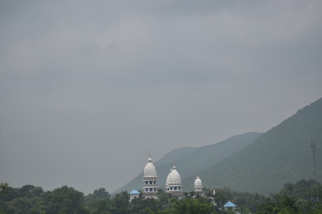 A serene image of Sri Shirdi Sai Baba temple surrounded by devotees.