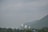 A serene landscape of an Indian temple surrounded by lush greenery.