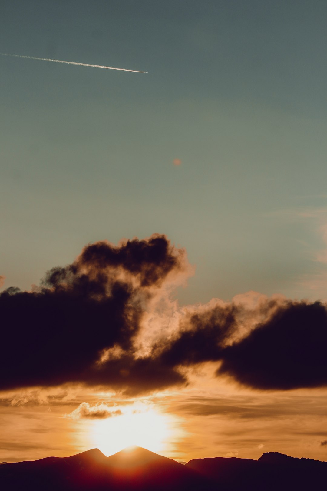 clouds and sun during sunset