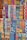 A vibrant array of intricately woven textile patterns featuring geometric designs. The textiles display a rich variety of colors and intricate details, arranged in rows and showcasing a range of traditional and cultural motifs.