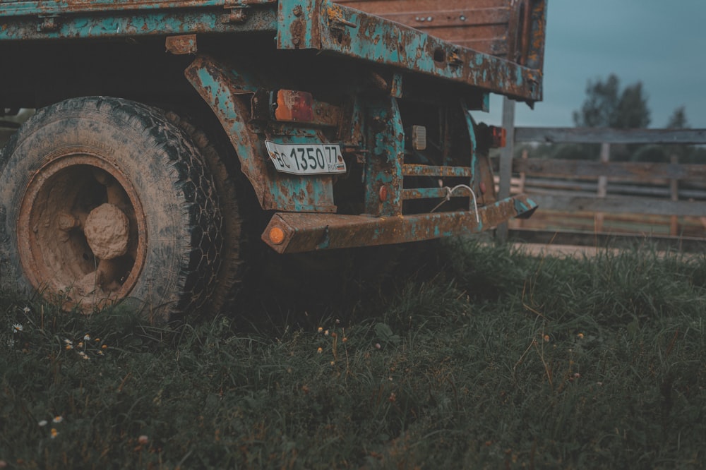 brown and black truck on brown field during daytime