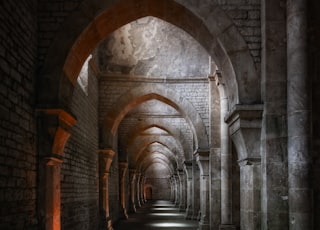 brown brick tunnel during daytime