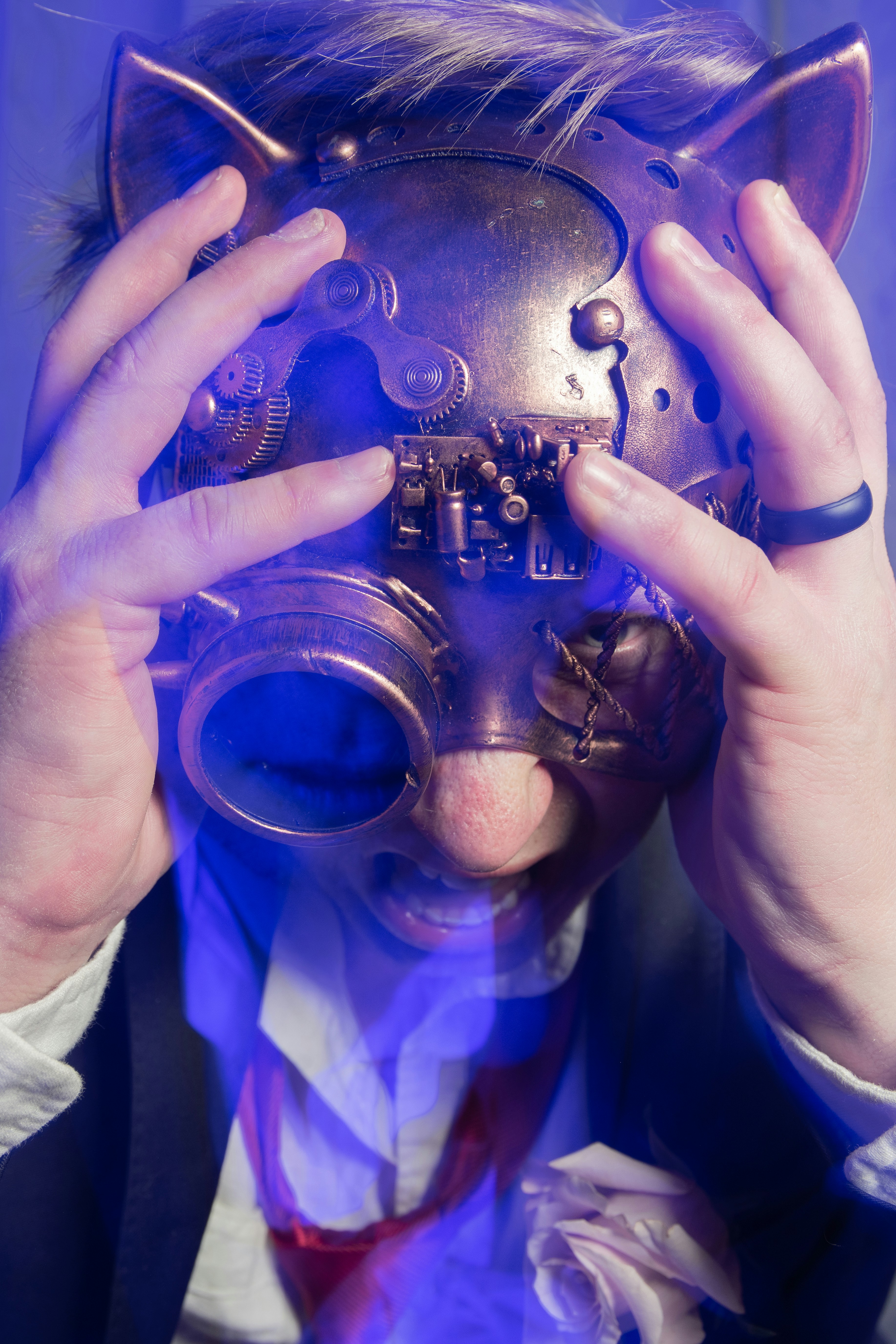 person holding silver and gold trophy