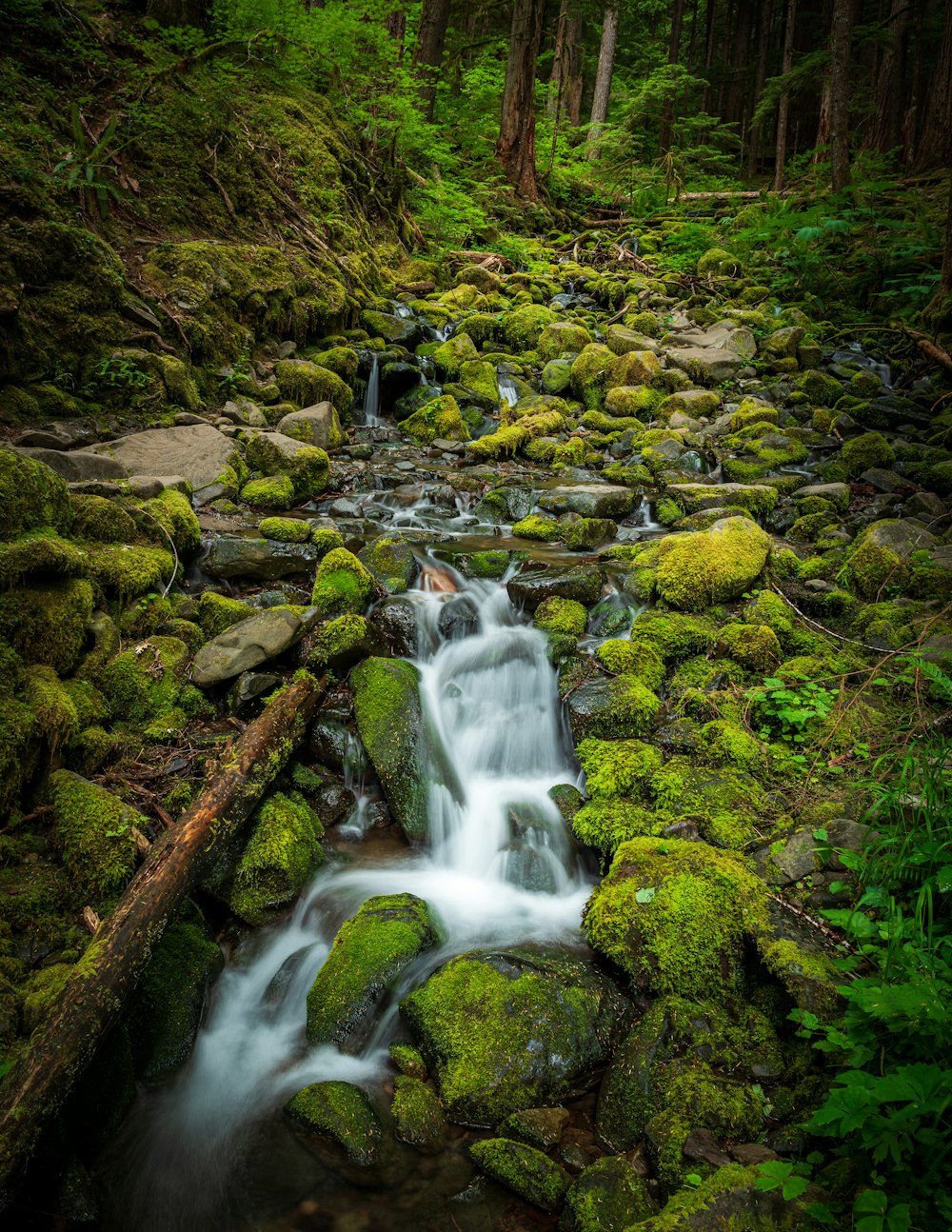 water falls on brown rocks