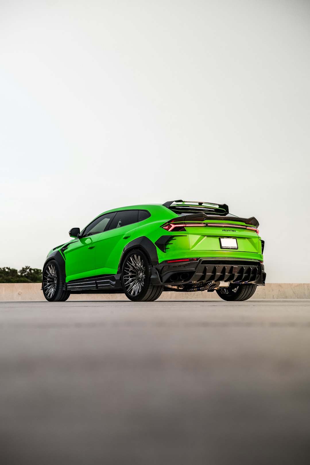 green chevrolet camaro on road