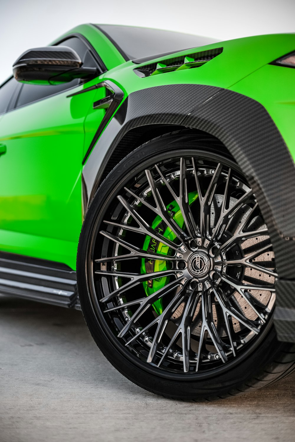 green car with black wheel