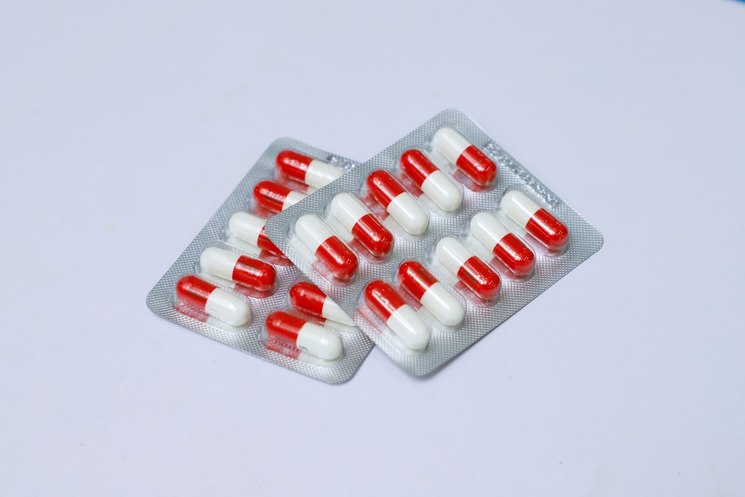 Blister pack with red and white pills. Medicine. Prescription drugs. Meds. Health & Wellness. Prescription medication. Pharmacy. Medical Drug. Pharmacological. Medication.