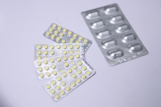 white and blue pill blister pack