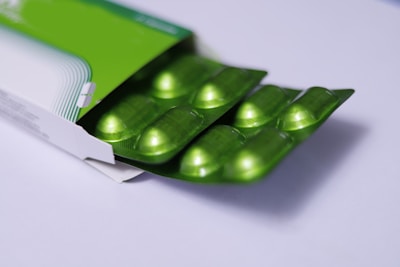 green plastic container on white table