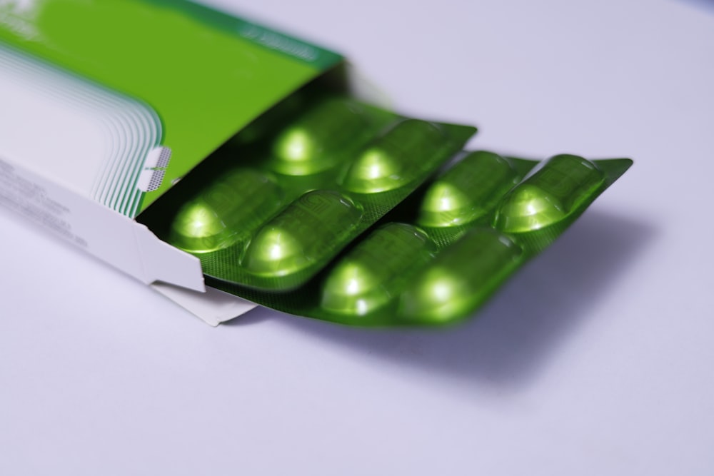 green plastic container on white table