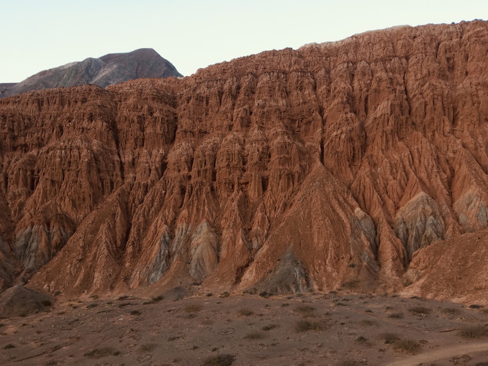 brown rock formation under blue sky during daytime