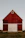 red and white wooden barn house