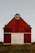 red and white wooden barn house