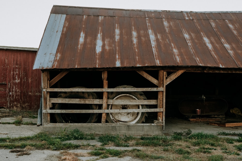 brown wooden house on brown field during daytime