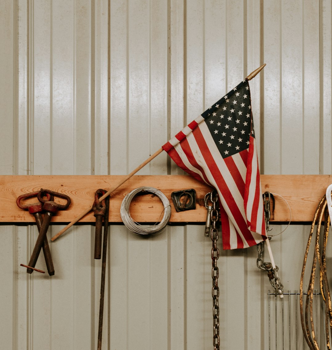 us a flag on brown wooden wall mounted rack