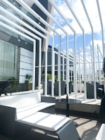 An inviting outdoor seating area with modern furniture pieces.
