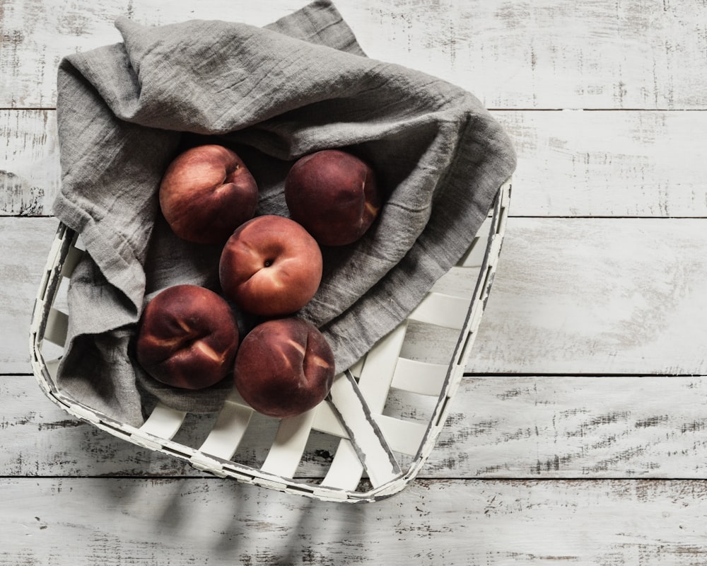 red apple fruit on gray textile