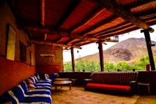 Shared outdoor seating area made with natural materials, ideal for groups after adventure.