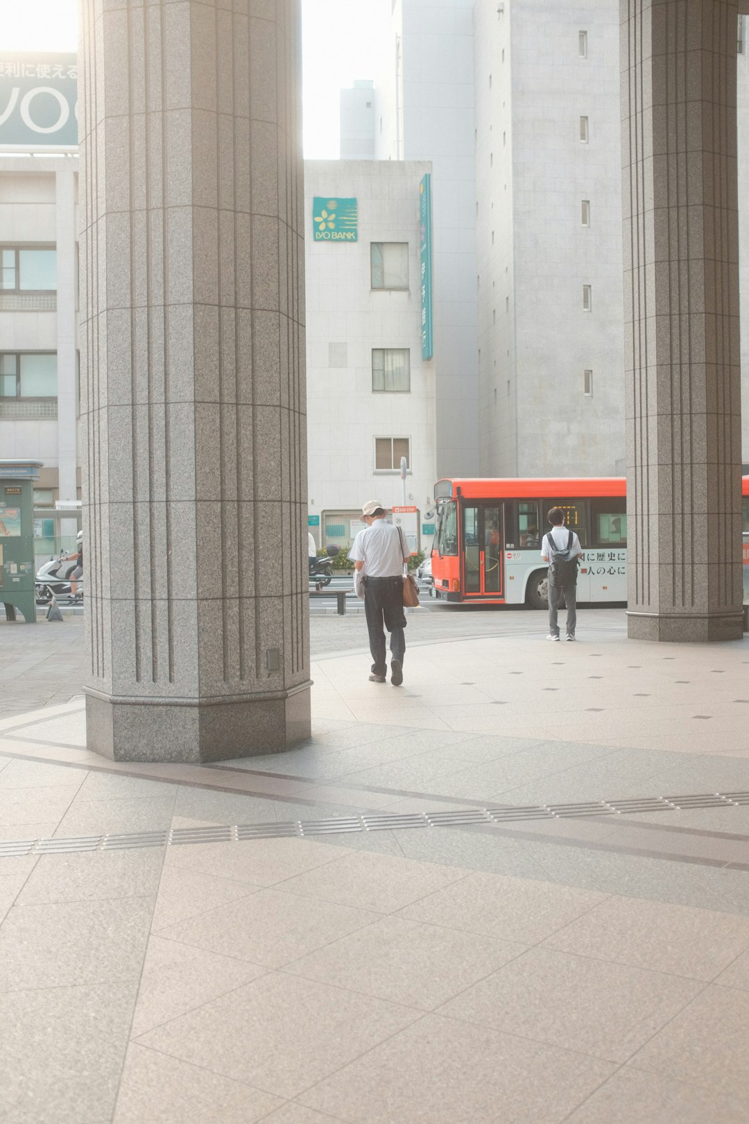 people walking on sidewalk near building during daytime