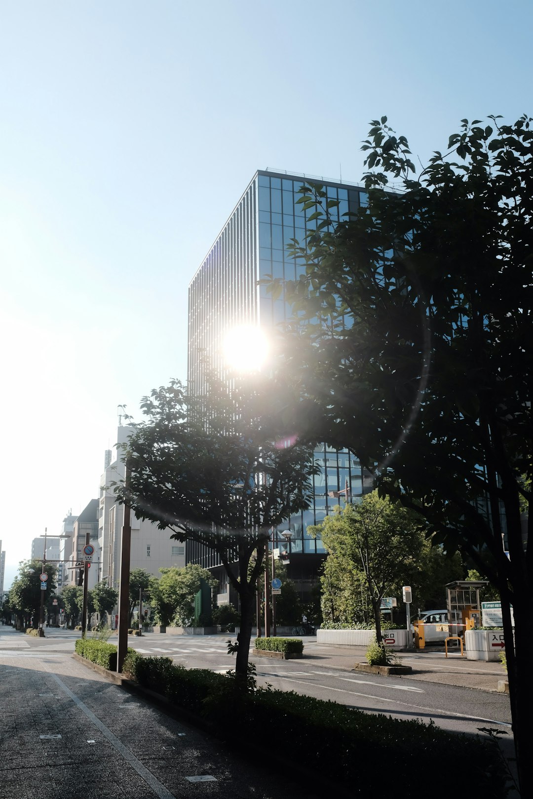 people walking on sidewalk near high rise building during daytime