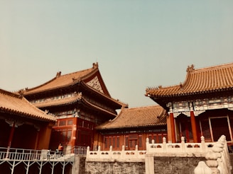 white and brown temple under white sky during daytime