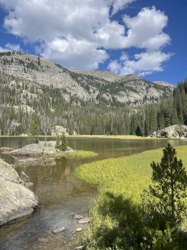 Grand Lake's East Inlet under open Colorado sky