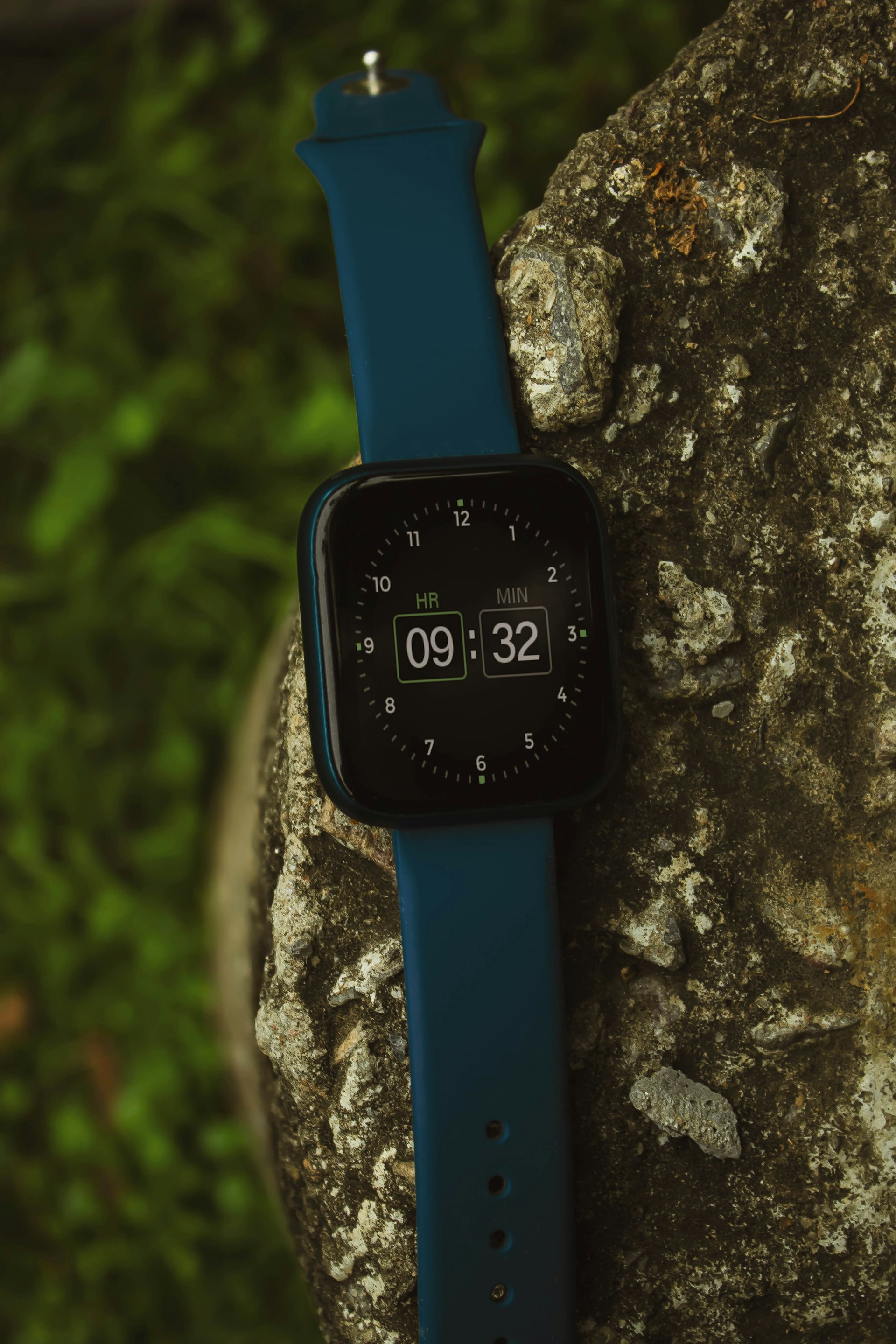 An active runner wearing the Velix smartwatch on a forest trail at sunrise, highlighting the watch's sporty design and durable strap.