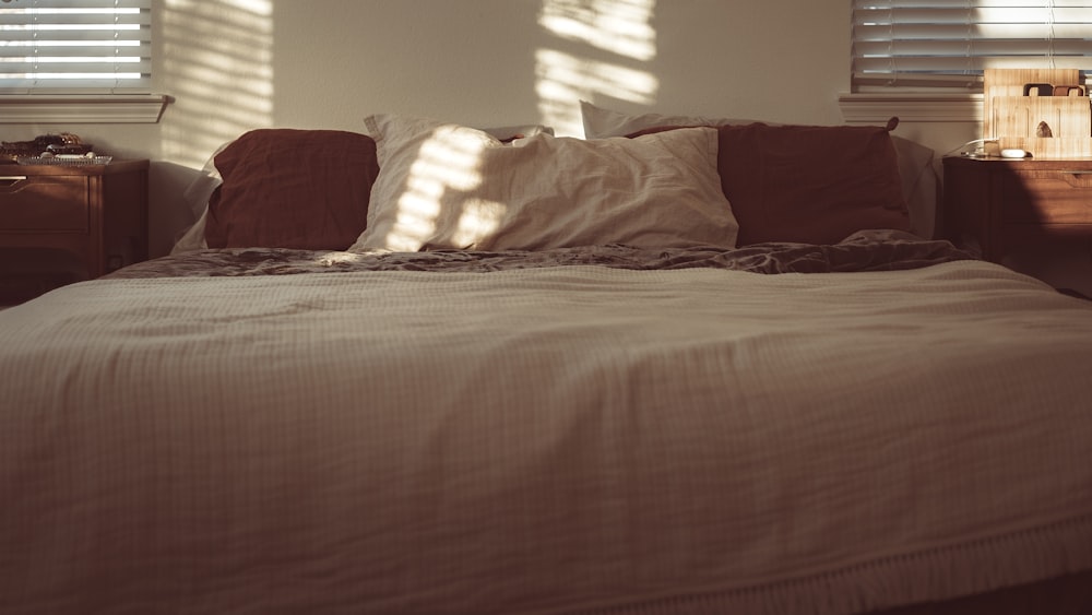 white pillow on white bed