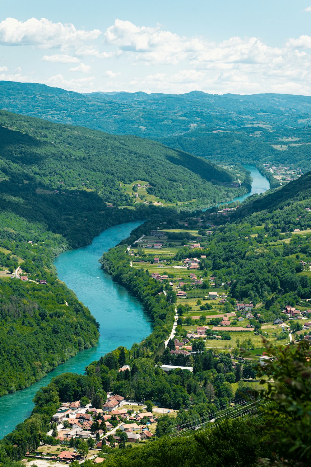 aerial view of green mountains and river