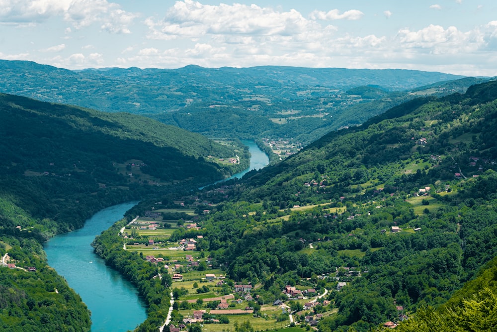 green mountains and river under blue sky during daytime
