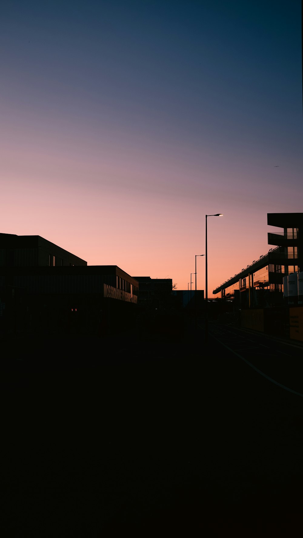 silhouette of building during sunset