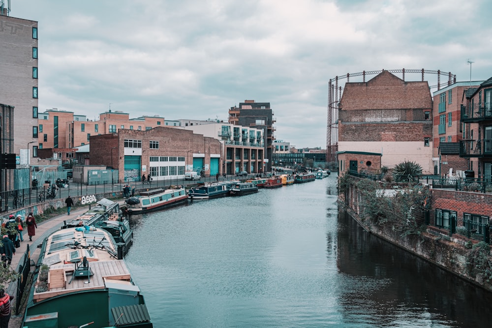 brown and white concrete building beside river during daytime