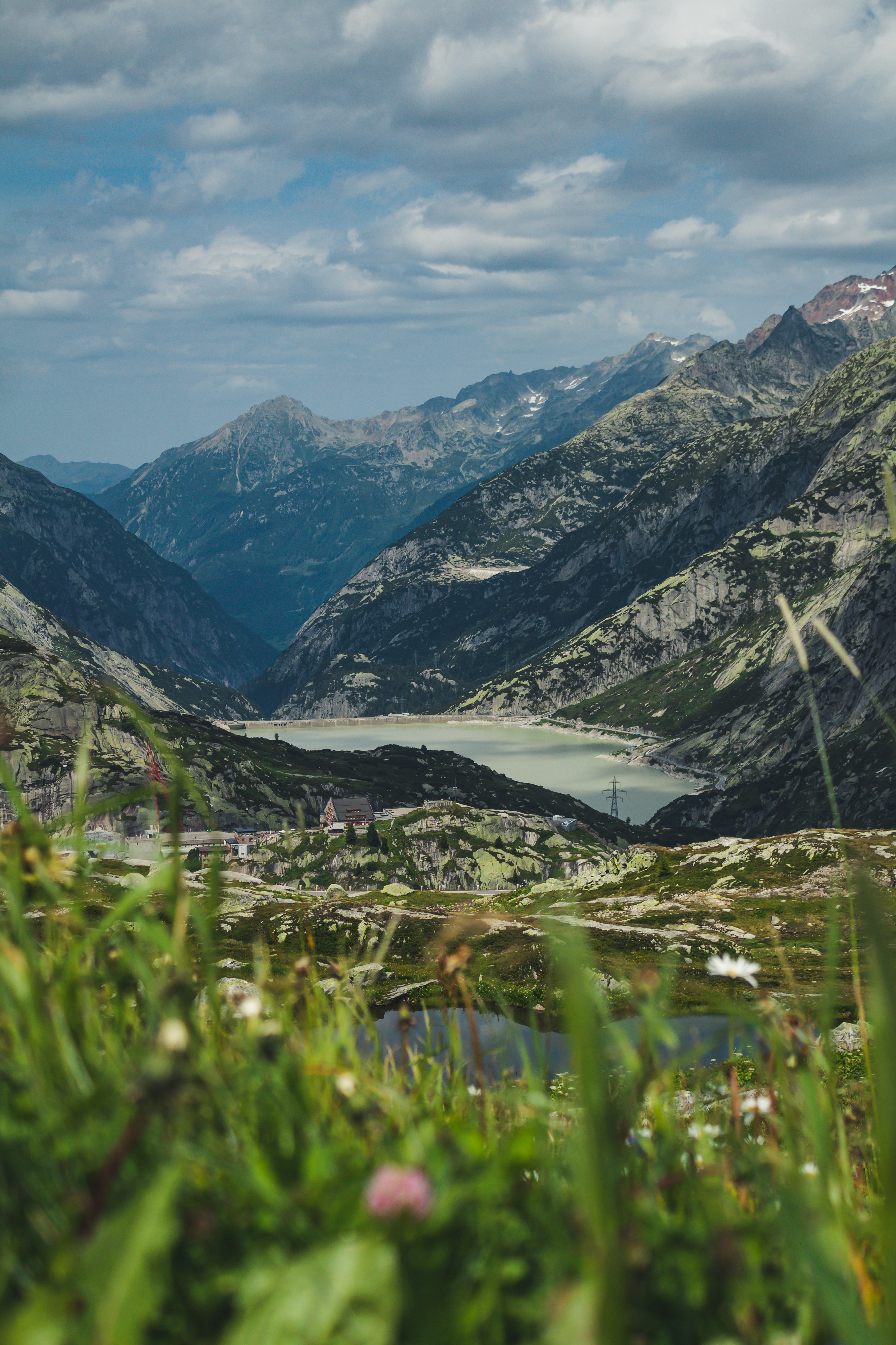 green grass field and mountains during daytime