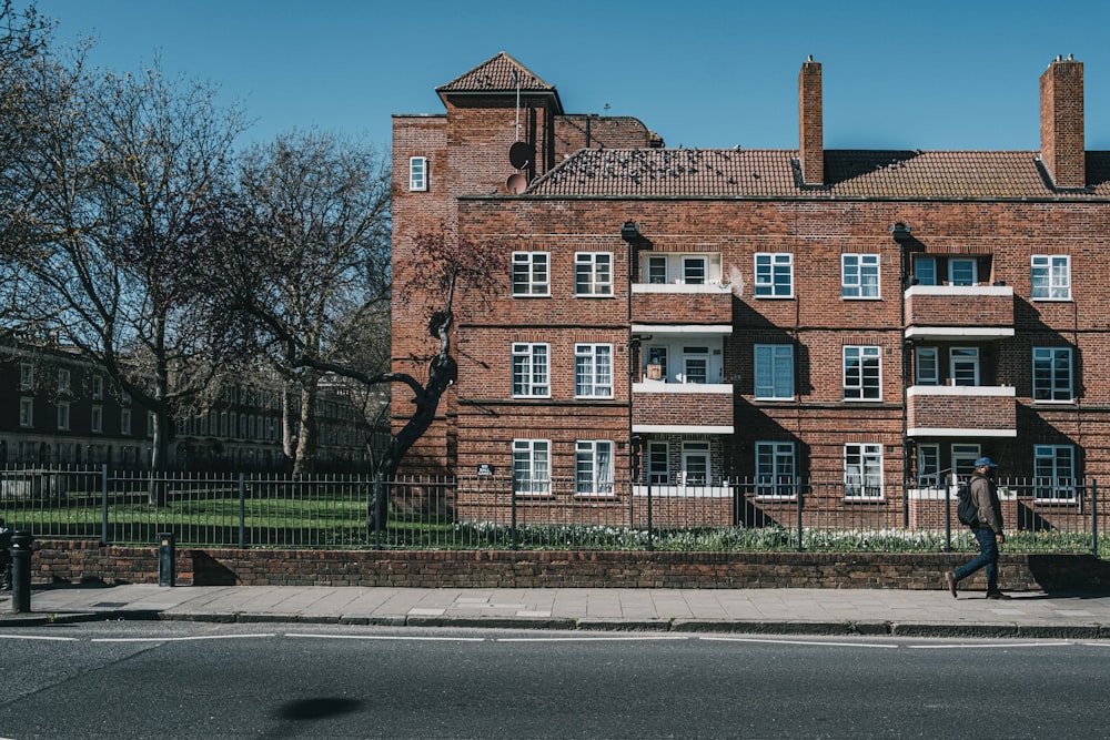 brown concrete building near bare trees during daytime